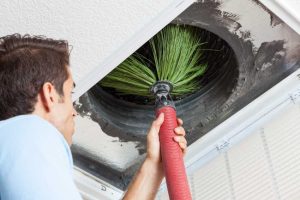 Professional conducting air duct cleaning in Wilmington.